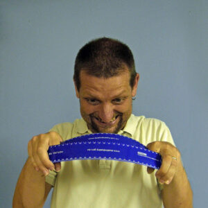 man bending a ruler